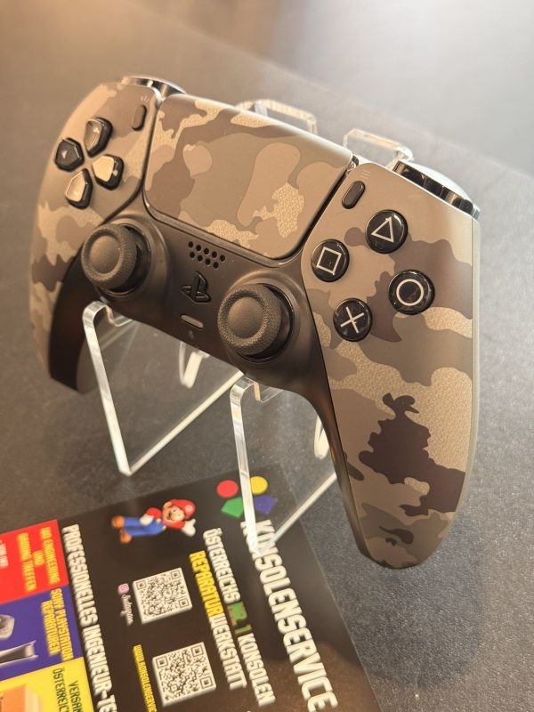 SONY DualSense® Wireless-Controller – Gray camouflage • Konsolenservice.at Desert camouflage PlayStation-style game controller with dual analog sticks and standard buttons on display.